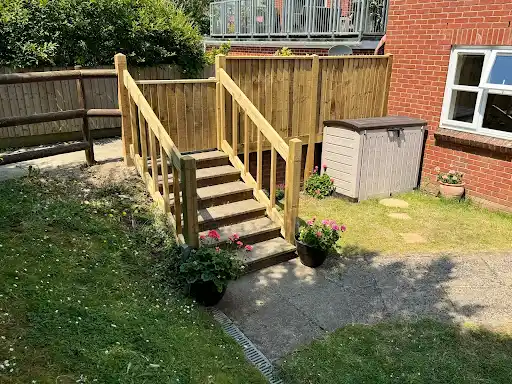 Timber steps and handrails leading up the garden