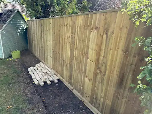 New closeboard fence along a side passage