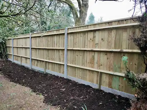 Closeboard fence on concrete posts and gravel boards
